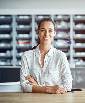smiling woman with arms folded